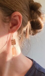 orange dangle earring model